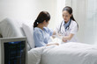 Female doctor cleaning her patient's arm before an injection