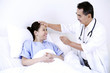 Doctor checking patient's temperature