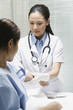 Female doctor cleaning her patient's arm before an injection