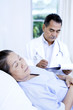 Doctor and patient in ward