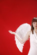 Young woman in angel costume