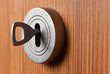 Silver  Key in the brown door
