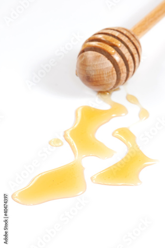 Photo: Honey and wood dipper Honey and wood dipper
