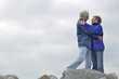 A mature couple embracing each other