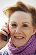A mature woman speaking to someone on the mobile