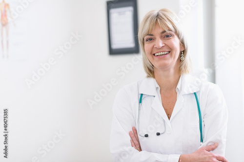 Photo: Portrait of smiling middle age doctor Portrait of smiling middle age doctor
