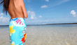 Closeup of woman with pareo standing on the beach