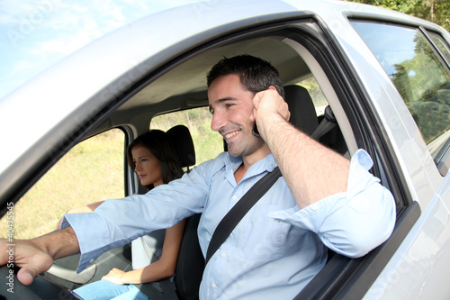 Photo: Man talking on mobilephone while driving Man talking on mobilephone while driving