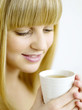 A woman holding a cup of coffee