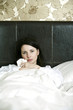A sick woman in bed