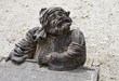 Elfish figure on tombstone