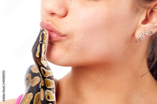 Photo: Teenage girl kissing small pet python Teenage girl kissing small pet python