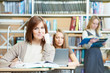 young student girl study with book in library