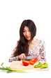 An Asian girl is cooking
