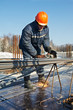 builder works with concrete reinforcement