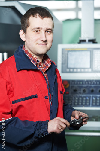 Photo: worker with measuring hand caliper tool worker with measuring hand caliper tool