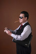 Businessman with cigar counting bank notes
