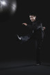 Businessman kicking globe