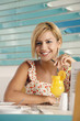 Woman with a glass of orange juice