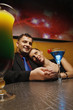 Man holding woman's hand, woman leaning on his shoulder