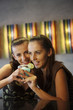 Women sharing a glass of cocktail