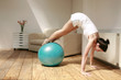 Woman exercising with fitness ball
