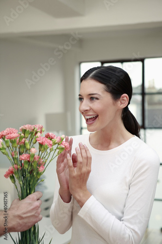 Photo: Woman receiving flowers Woman receiving flowers