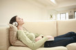 Woman listening to music with her eyes closed