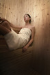 Woman relaxing in sauna