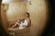 Woman relaxing in sauna
