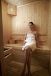 Woman relaxing in sauna