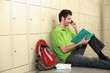 Man talking on the phone while reading