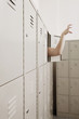 Human arm coming out from a locker