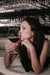 Woman kissing wine glass