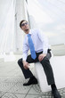 Photo: Businessman with cool sunglasses posing for the camera Businessman with cool sunglasses posing for the camera