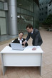 Photo: Businessman giving explanation to businesswoman Businessman giving explanation to businesswoman