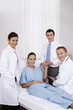 Doctors and family member attending to patient