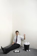 Photo: Businessman throwing paper into a dustbin of crumpled paper balls Businessman throwing paper into a dustbin of crumpled paper balls