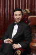 Man in tuxedo holding a cigar