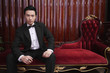 Man in tuxedo holding a cigar