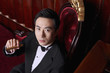 Man in tuxedo holding a cigar