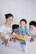 Woman teaching children how to use the abacus