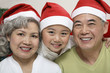 Foto: Boy posing with senior couple Boy posing with senior couple