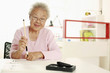 Foto: Senior woman writing calligraphy Senior woman writing calligraphy