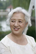 Foto: Senior woman smiling while looking away Senior woman smiling while looking away