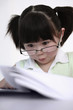 Girl with glasses looking at documents