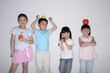 Children holding and balancing fruit