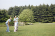 Photo: Girl flying kite with her parents Girl flying kite with her parents