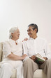 Senior couple smiling while looking at each other