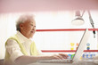 Photo: Senior woman using the laptop Senior woman using the laptop